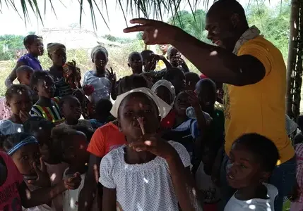 Nicholas Sonpon worshipping with children